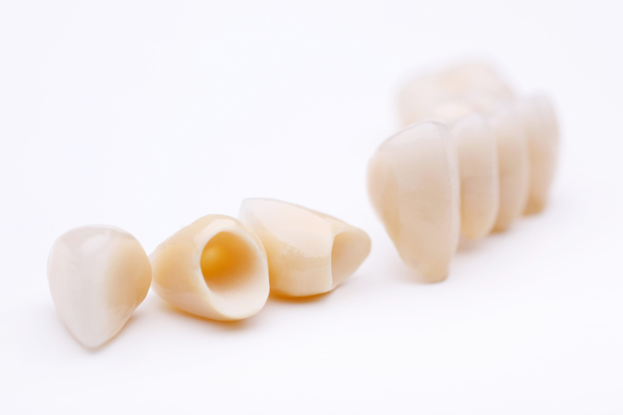 Macro,Of,Prosthetic,Teeth,Isolated,On,A,White,Background